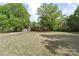 Expansive property with a well-maintained lawn and mature trees at 1099 S Potter Rd, Lancaster, SC 29720