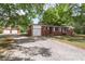 Charming brick home with detached garage and well-maintained landscaping at 1099 S Potter Rd, Lancaster, SC 29720