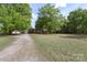 Spacious property with large trees and a well-maintained lawn at 1099 S Potter Rd, Lancaster, SC 29720