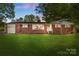 Charming brick home with lush front lawn and mature trees at 1099 S Potter Rd, Lancaster, SC 29720