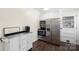 Functional kitchen area with stainless steel appliances, white cabinets, and ample storage at 1099 S Potter Rd, Lancaster, SC 29720