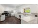 Well-lit kitchen with modern stainless steel appliances, white countertops, and backsplash at 1099 S Potter Rd, Lancaster, SC 29720