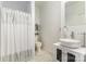 Bright bathroom with modern sink vanity, and shower with decorative shower curtain at 1151 Trull Hinson Rd, Wingate, NC 28174