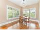 Cozy breakfast nook features natural light and a charming chandelier at 1151 Trull Hinson Rd, Wingate, NC 28174