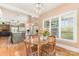 Inviting breakfast nook adjacent to kitchen has hardwood floors and natural lighting at 1151 Trull Hinson Rd, Wingate, NC 28174