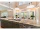 Well-equipped kitchen features a stainless steel sink and a breakfast bar at 1151 Trull Hinson Rd, Wingate, NC 28174