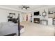 Spacious primary bedroom boasts a fireplace, ceiling fan, and adjacent walk-in closet for ultimate convenience at 1151 Trull Hinson Rd, Wingate, NC 28174