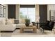 Cozy living room with comfortable seating, a coffee table, and natural light from a large window at 1202 Blackburn Cir, Edgemoor, SC 29712