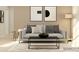 Cozy living room with a light gray sofa, minimalist decor, and a geometric rug at 1202 Blackburn Cir, Edgemoor, SC 29712