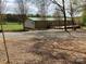 Rear of the home showcases large deck with expansive backyard views at 13079 Philadelphia Church Rd, Oakboro, NC 28129