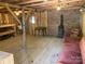 Interior view of the barn featuring wood floors, and brick accents at 13079 Philadelphia Church Rd, Oakboro, NC 28129