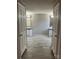 Open view into the main bedroom with two separate bathrooms and updated flooring at 13079 Philadelphia Church Rd, Oakboro, NC 28129