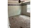 Well-lit bedroom with neutral carpet and a view from the window, offering a relaxing space at 13079 Philadelphia Church Rd, Oakboro, NC 28129