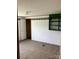 Quaint bedroom with carpet, a closet view, and shelving, providing ample storage space at 13079 Philadelphia Church Rd, Oakboro, NC 28129