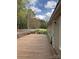 Large wooden deck with a view of the surrounding trees and backyard at 13079 Philadelphia Church Rd, Oakboro, NC 28129