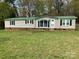 Attractive single story home with green shutters and freshly mowed lawn at 13079 Philadelphia Church Rd, Oakboro, NC 28129
