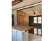 Living room with a breakfast bar, hardwood floors and a view of the yard at 13079 Philadelphia Church Rd, Oakboro, NC 28129