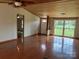 Living room with hardwood floors, wood paneled ceiling and trim, and a double window at 13079 Philadelphia Church Rd, Oakboro, NC 28129