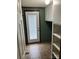 Functional mudroom featuring tile floors, built-in shelves, and a door to the outdoors at 13079 Philadelphia Church Rd, Oakboro, NC 28129