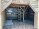 Rustic outbuilding with ladder and storage, showcasing functionality and potential for various uses at 13079 Philadelphia Church Rd, Oakboro, NC 28129
