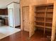 A large wooden pantry provides plenty of storage in this spacious kitchen at 13079 Philadelphia Church Rd, Oakboro, NC 28129