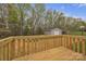 The backyard features a deck, shed, grassy yard, and mature trees at 132 Riverview Acres Ln, Taylorsville, NC 28681