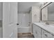 Bathroom featuring a shower and tub combination and a modern vanity with white cabinets at 132 Riverview Acres Ln, Taylorsville, NC 28681
