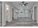 Bright kitchen with white cabinets, stainless steel appliances, and stylish gray flooring at 132 Riverview Acres Ln, Taylorsville, NC 28681