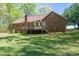 Brick home with a deck and a sprawling backyard, perfect for outdoor entertaining at 1478 Smith Farm Rd, Lincolnton, NC 28092