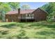 This brick home features a well-maintained back yard and deck, perfect for relaxing at 1478 Smith Farm Rd, Lincolnton, NC 28092