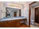 Bathroom with a large mirror, wooden cabinets and a toilet at 1478 Smith Farm Rd, Lincolnton, NC 28092