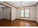 Dining room features a chandelier, wood floors and a window at 1478 Smith Farm Rd, Lincolnton, NC 28092