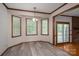 Bright dining area featuring windows, wood trim and wood-look floors at 1478 Smith Farm Rd, Lincolnton, NC 28092