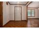 Entryway features a solid white front door, wood floors, and wood trim at 1478 Smith Farm Rd, Lincolnton, NC 28092