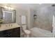 Bathroom featuring a tub shower with tile surround and a single sink vanity at 14917 Dewpoint Pl, Huntersville, NC 28078