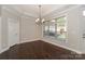 Bright dining area with hardwood floors, large window, and neutral walls, ready for your personal touch at 14917 Dewpoint Pl, Huntersville, NC 28078