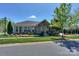 Charming single-story home with stone accents, landscaping and well-manicured front yard at 14917 Dewpoint Pl, Huntersville, NC 28078