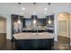 Kitchen with stainless steel appliances, granite countertops, and a large kitchen island at 14917 Dewpoint Pl, Huntersville, NC 28078