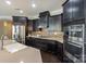 Bright kitchen with stainless steel appliances, plenty of cabinet storage, and a large center island at 14917 Dewpoint Pl, Huntersville, NC 28078