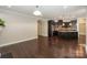 Open concept layout of the kitchen and living room featuring a cozy fireplace at 14917 Dewpoint Pl, Huntersville, NC 28078