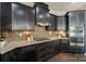 Gourmet kitchen with stainless steel appliances, custom cabinetry, and a gas cooktop at 14917 Dewpoint Pl, Huntersville, NC 28078