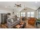 Open-concept living room with kitchen, vaulted ceilings, and hardwood floors at 14917 Dewpoint Pl, Huntersville, NC 28078