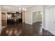 Open concept living area showcases hardwood floors and seamless flow between living, dining, and kitchen spaces at 14917 Dewpoint Pl, Huntersville, NC 28078