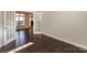 Bright room with hardwood floors, French doors to another area, offering versatility and style at 14917 Dewpoint Pl, Huntersville, NC 28078