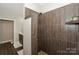 Walk-in shower featuring upgraded tile and built-in shelving at 14917 Dewpoint Pl, Huntersville, NC 28078