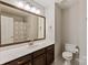 Bathroom featuring a clean vanity, a large mirror, and a tiled floor at 1518 Sylvia Ct, Charlotte, NC 28205