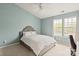 Bright bedroom featuring a neutral color scheme, ceiling fan, and large windows at 1518 Sylvia Ct, Charlotte, NC 28205