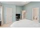 Bedroom featuring a desk, an attached bathroom and an additional doorway at 1518 Sylvia Ct, Charlotte, NC 28205