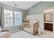 Inviting Bedroom with a crib, a window, and easy access to a bathroom at 1518 Sylvia Ct, Charlotte, NC 28205