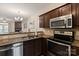 Updated kitchen with stainless steel appliances and granite countertops at 1518 Sylvia Ct, Charlotte, NC 28205